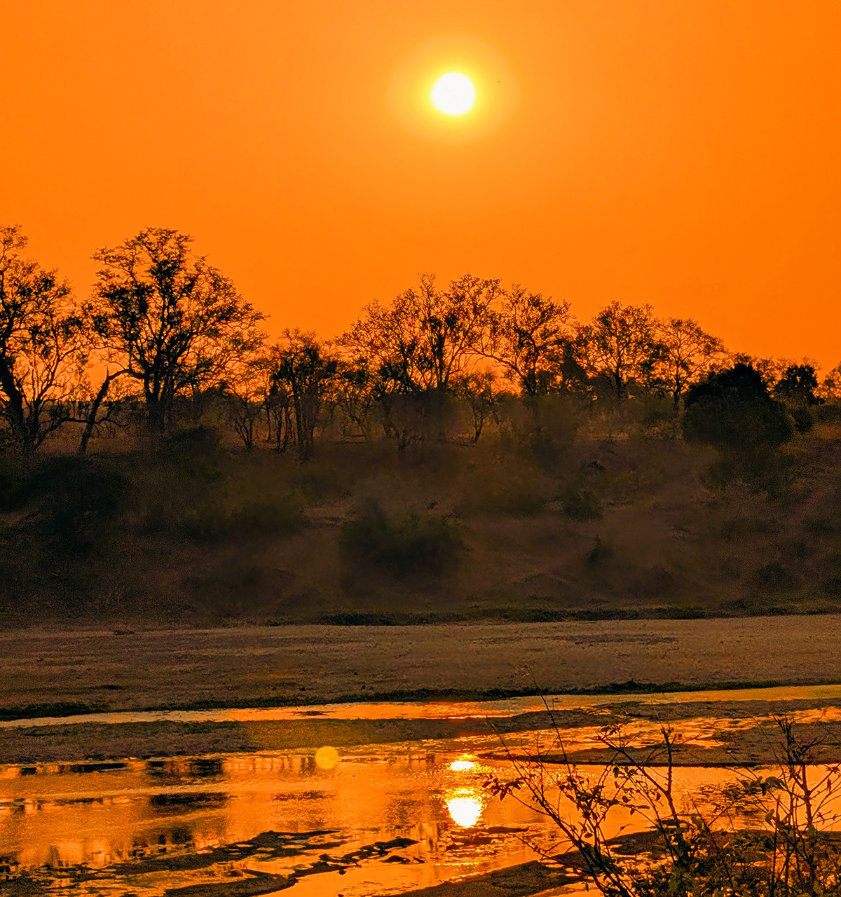The sun setting over the Kruger National Park and Crocodile River