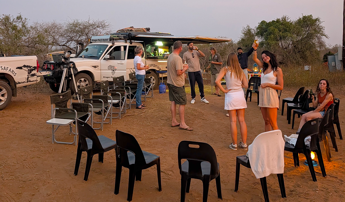 Preparing and enjoying dinner at the fence of the Kruger National Park overlooking the Crocodile River.