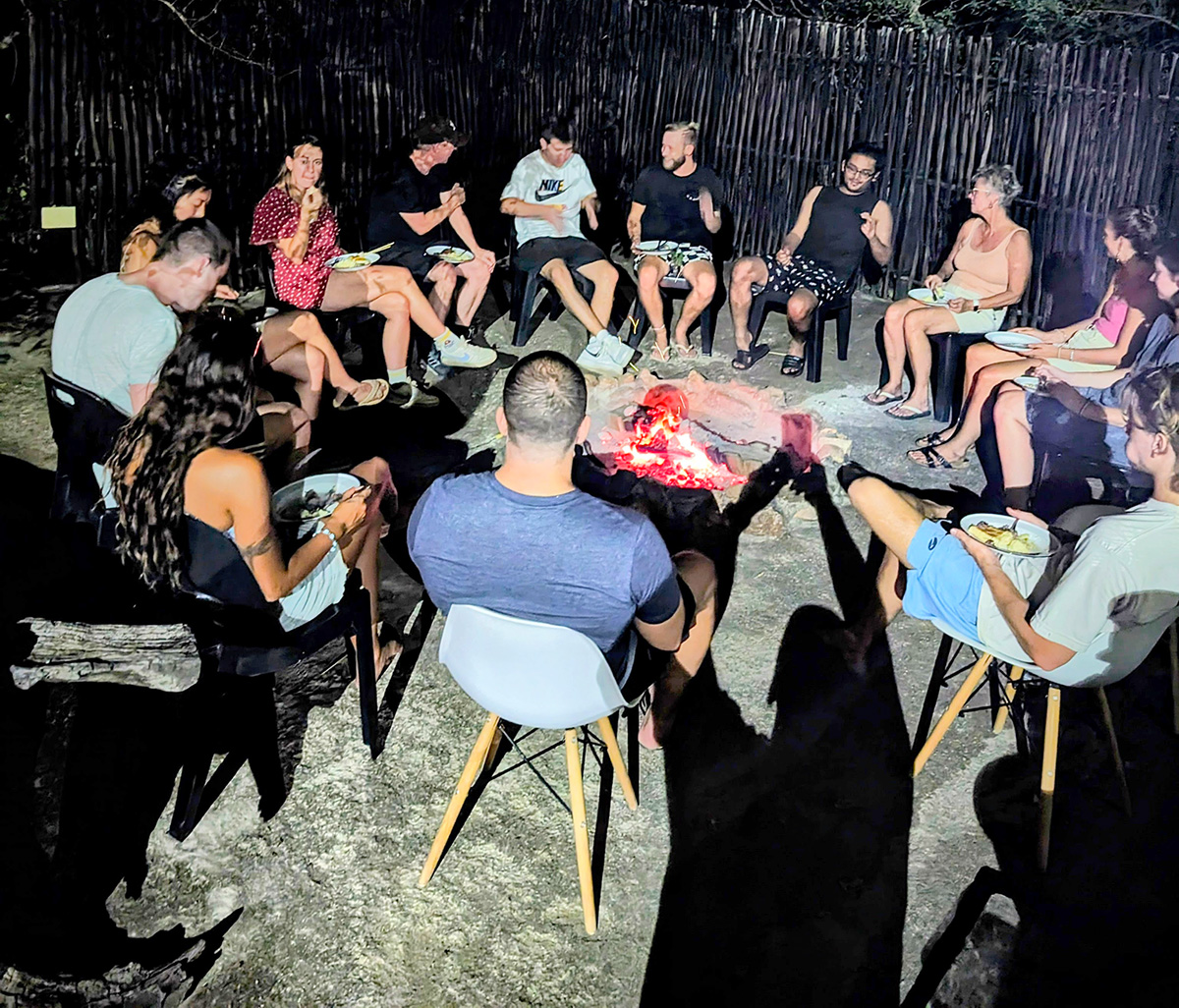 Dinner around a fire at Kruger Park Hostel